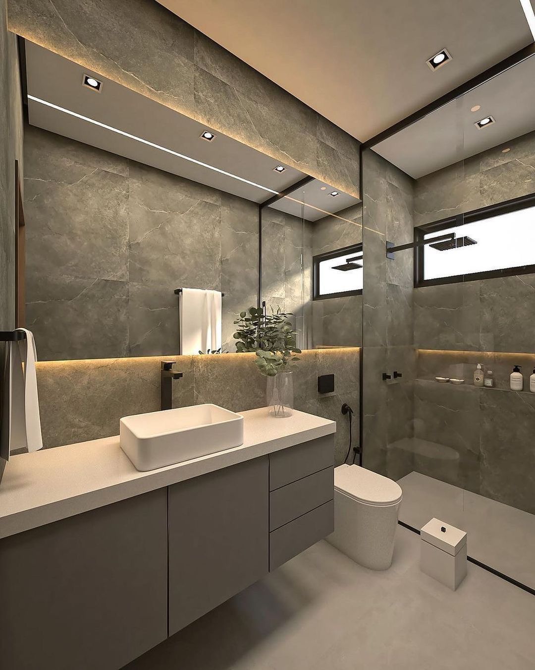Modern gray bathroom remodel with floating vanity, backlit mirror and walk-in shower